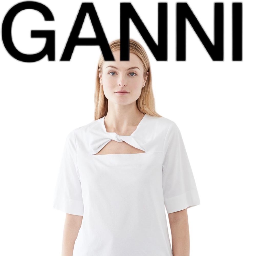 Ganni white top in Medium. Cut out in front.